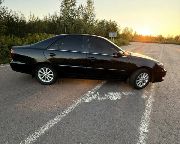 Черный Тойота Камри, объемом двигателя 3 л и пробегом 300 тыс. км за 6000 $, фото 14 на Automoto.ua