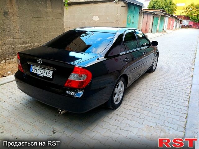 Черный Тойота Камри, объемом двигателя 3 л и пробегом 344 тыс. км за 6300 $, фото 1 на Automoto.ua