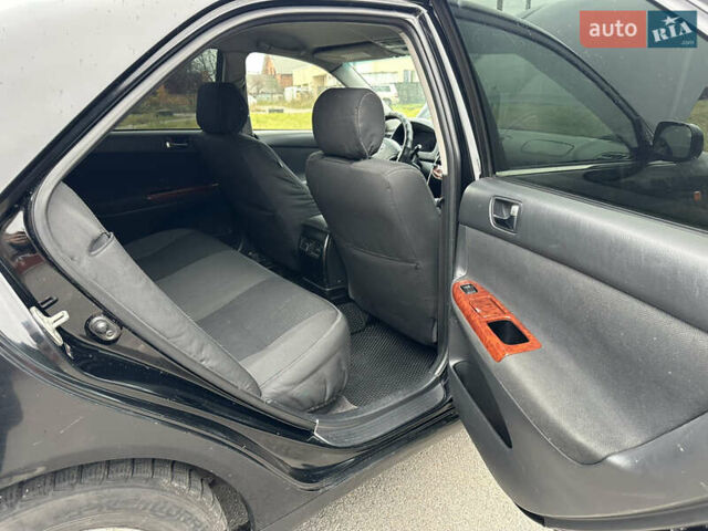 Черный Тойота Камри, объемом двигателя 2.4 л и пробегом 553 тыс. км за 5100 $, фото 7 на Automoto.ua