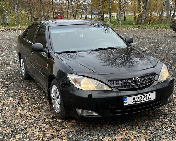 Чорний Тойота Камрі, об'ємом двигуна 2.4 л та пробігом 310 тис. км за 5600 $, фото 2 на Automoto.ua