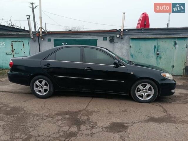 Черный Тойота Камри, объемом двигателя 3 л и пробегом 370 тыс. км за 4500 $, фото 1 на Automoto.ua