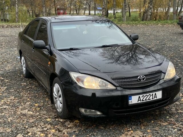 Черный Тойота Камри, объемом двигателя 2.4 л и пробегом 310 тыс. км за 5600 $, фото 1 на Automoto.ua