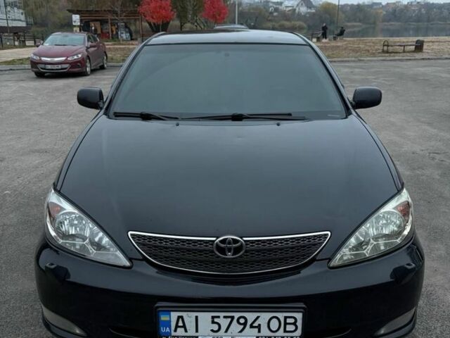 Черный Тойота Камри, объемом двигателя 2.4 л и пробегом 570 тыс. км за 6199 $, фото 4 на Automoto.ua
