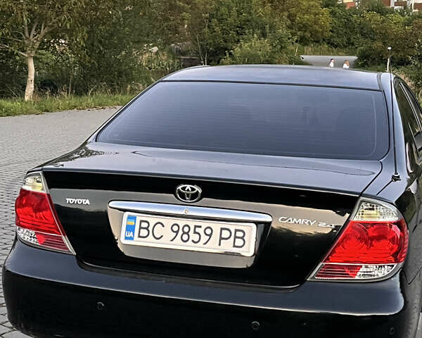 Черный Тойота Камри, объемом двигателя 2.4 л и пробегом 317 тыс. км за 5650 $, фото 4 на Automoto.ua