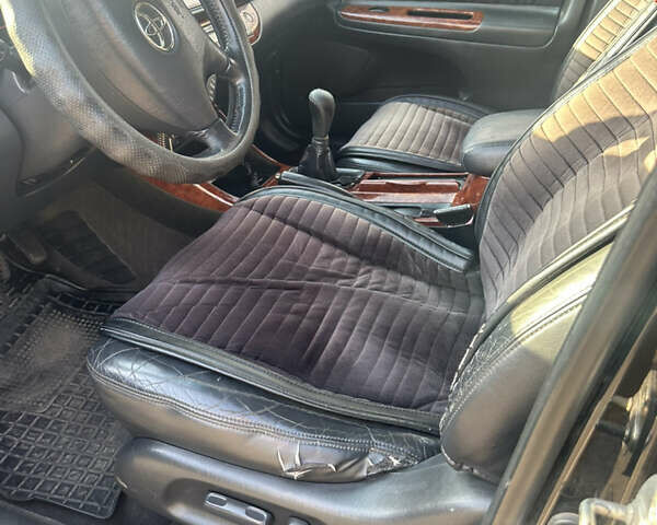 Черный Тойота Камри, объемом двигателя 2.4 л и пробегом 312 тыс. км за 7200 $, фото 21 на Automoto.ua