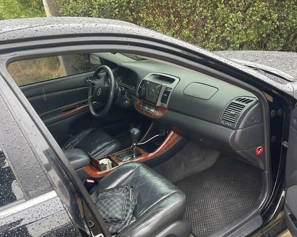 Черный Тойота Камри, объемом двигателя 3 л и пробегом 340 тыс. км за 6700 $, фото 6 на Automoto.ua