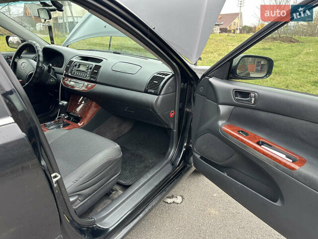 Черный Тойота Камри, объемом двигателя 2.4 л и пробегом 553 тыс. км за 5100 $, фото 6 на Automoto.ua