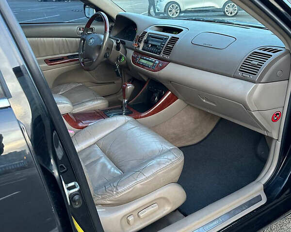 Черный Тойота Камри, объемом двигателя 2.4 л и пробегом 309 тыс. км за 6699 $, фото 14 на Automoto.ua