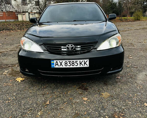 Черный Тойота Камри, объемом двигателя 3 л и пробегом 301 тыс. км за 4500 $, фото 1 на Automoto.ua
