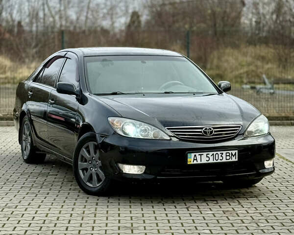 Чорний Тойота Камрі, об'ємом двигуна 3 л та пробігом 203 тис. км за 3999 $, фото 4 на Automoto.ua