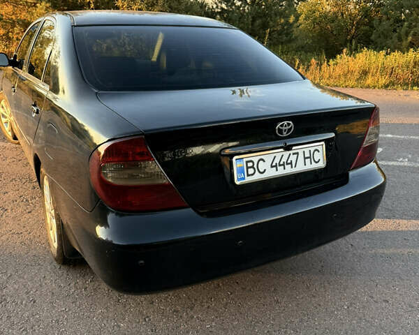 Черный Тойота Камри, объемом двигателя 3 л и пробегом 300 тыс. км за 6000 $, фото 2 на Automoto.ua