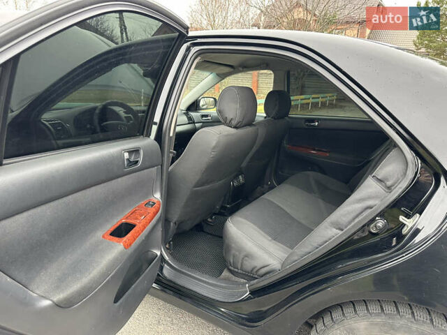 Черный Тойота Камри, объемом двигателя 2.4 л и пробегом 553 тыс. км за 5100 $, фото 9 на Automoto.ua