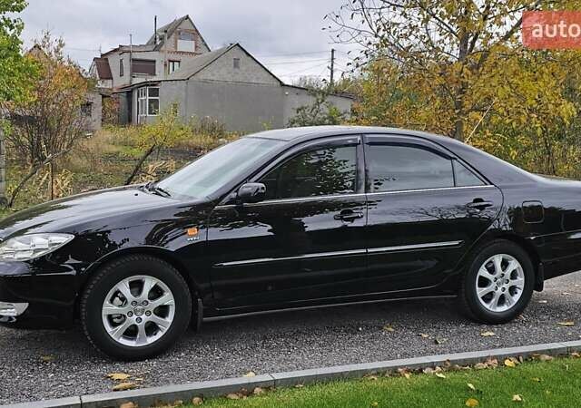 Тойота Камри 2004 в Каменское - Днепродзержинск на Automoto.ua Черный Тойота Камри, объемом двигателя 2 л и пробегом 180 тыс. км за 6700 $, фото 2 на Automoto.ua