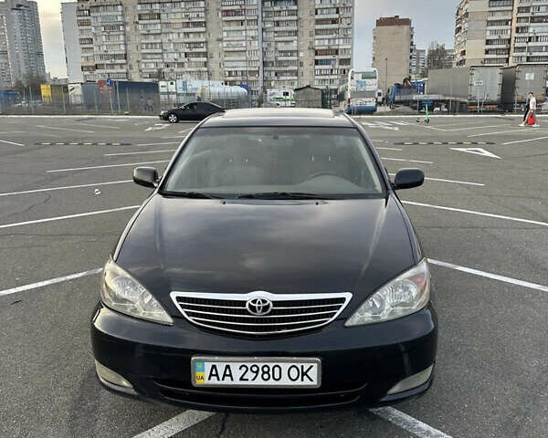 Черный Тойота Камри, объемом двигателя 2.4 л и пробегом 315 тыс. км за 5800 $, фото 14 на Automoto.ua