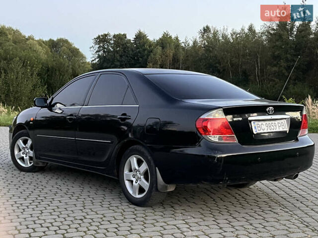 Черный Тойота Камри, объемом двигателя 2.4 л и пробегом 317 тыс. км за 5650 $, фото 5 на Automoto.ua