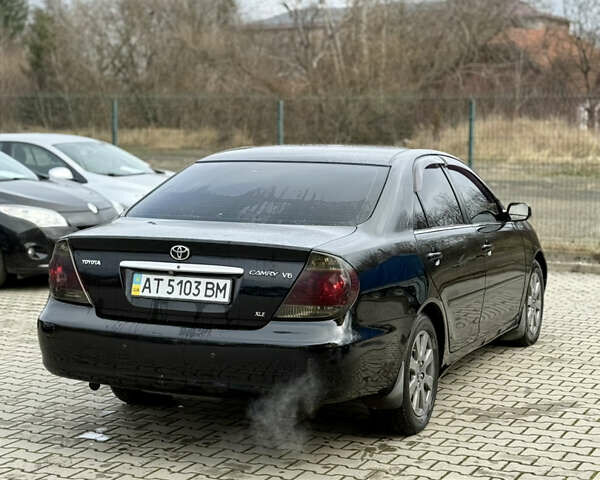 Чорний Тойота Камрі, об'ємом двигуна 3 л та пробігом 203 тис. км за 3999 $, фото 6 на Automoto.ua