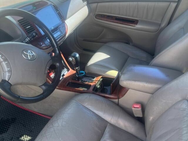 Черный Тойота Камри, объемом двигателя 2.4 л и пробегом 240 тыс. км за 6000 $, фото 4 на Automoto.ua