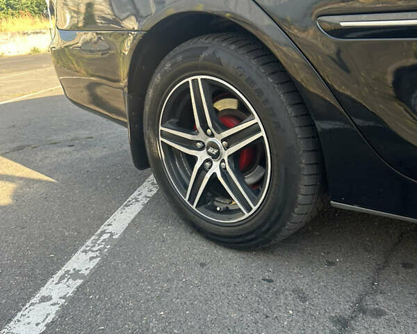 Черный Тойота Камри, объемом двигателя 2.4 л и пробегом 312 тыс. км за 7200 $, фото 4 на Automoto.ua
