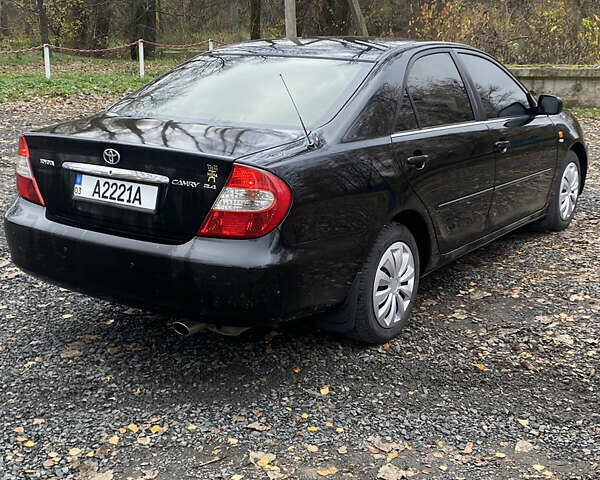 Чорний Тойота Камрі, об'ємом двигуна 2.4 л та пробігом 310 тис. км за 5600 $, фото 5 на Automoto.ua