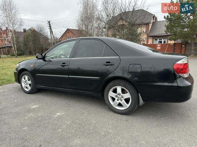 Черный Тойота Камри, объемом двигателя 2.4 л и пробегом 553 тыс. км за 5100 $, фото 2 на Automoto.ua