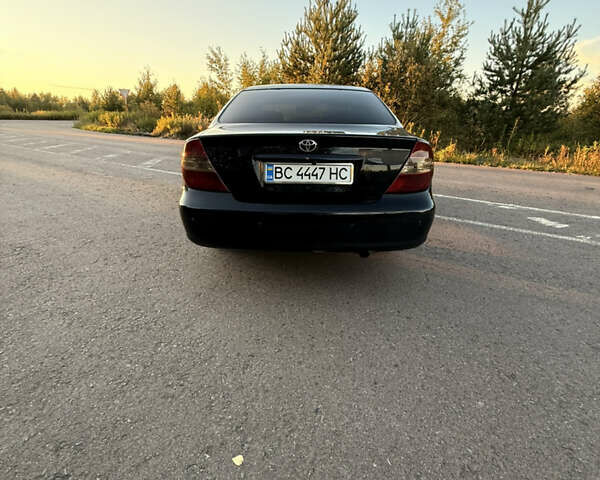 Черный Тойота Камри, объемом двигателя 3 л и пробегом 310 тыс. км за 5800 $, фото 30 на Automoto.ua