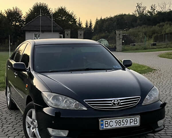 Черный Тойота Камри, объемом двигателя 2.4 л и пробегом 317 тыс. км за 5650 $, фото 1 на Automoto.ua
