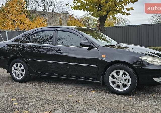 Тойота Камри 2004 в Каменское - Днепродзержинск на Automoto.ua Черный Тойота Камри, объемом двигателя 2 л и пробегом 180 тыс. км за 6700 $, фото 6 на Automoto.ua