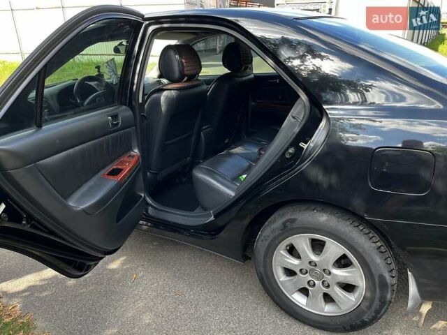 Чорний Тойота Камрі, об'ємом двигуна 2.37 л та пробігом 437 тис. км за 6400 $, фото 16 на Automoto.ua