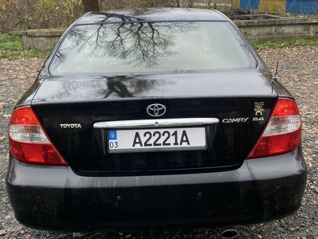Черный Тойота Камри, объемом двигателя 2.4 л и пробегом 310 тыс. км за 5600 $, фото 3 на Automoto.ua