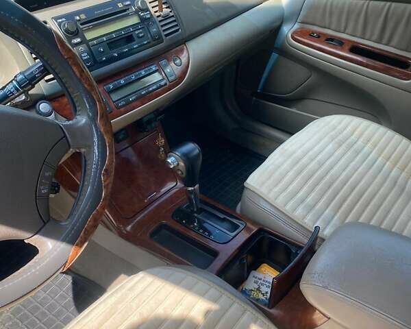 Черный Тойота Камри, объемом двигателя 2.36 л и пробегом 285 тыс. км за 6300 $, фото 7 на Automoto.ua