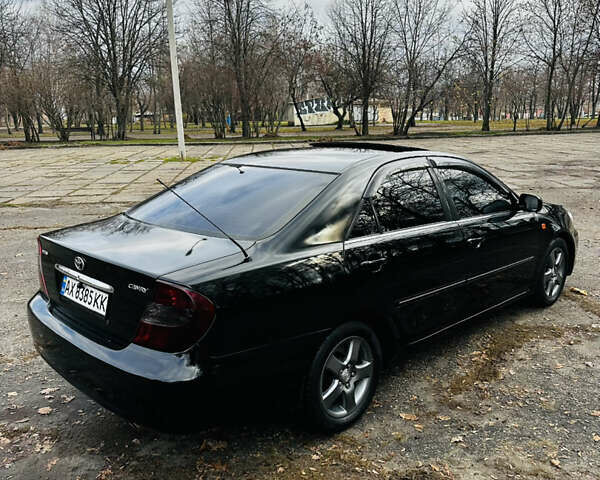 Черный Тойота Камри, объемом двигателя 3 л и пробегом 301 тыс. км за 4500 $, фото 3 на Automoto.ua
