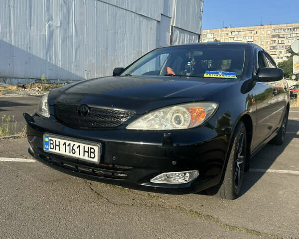 Черный Тойота Камри, объемом двигателя 2.4 л и пробегом 312 тыс. км за 7200 $, фото 2 на Automoto.ua