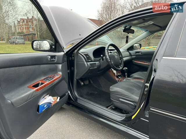 Черный Тойота Камри, объемом двигателя 2.4 л и пробегом 553 тыс. км за 5100 $, фото 10 на Automoto.ua