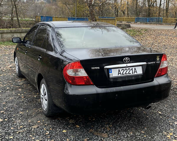 Чорний Тойота Камрі, об'ємом двигуна 2.4 л та пробігом 310 тис. км за 5600 $, фото 4 на Automoto.ua