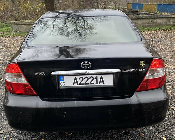 Чорний Тойота Камрі, об'ємом двигуна 2.4 л та пробігом 310 тис. км за 5600 $, фото 3 на Automoto.ua