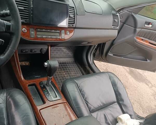 Черный Тойота Камри, объемом двигателя 3 л и пробегом 370 тыс. км за 4500 $, фото 16 на Automoto.ua