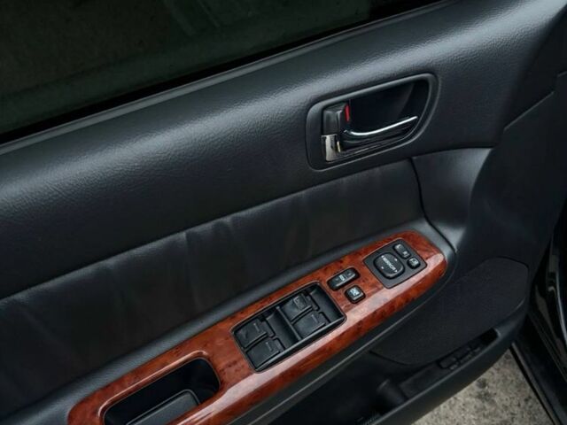 Черный Тойота Камри, объемом двигателя 2.4 л и пробегом 570 тыс. км за 6199 $, фото 1 на Automoto.ua