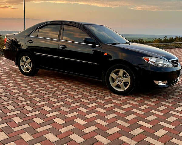 Черный Тойота Камри, объемом двигателя 3 л и пробегом 285 тыс. км за 6500 $, фото 12 на Automoto.ua