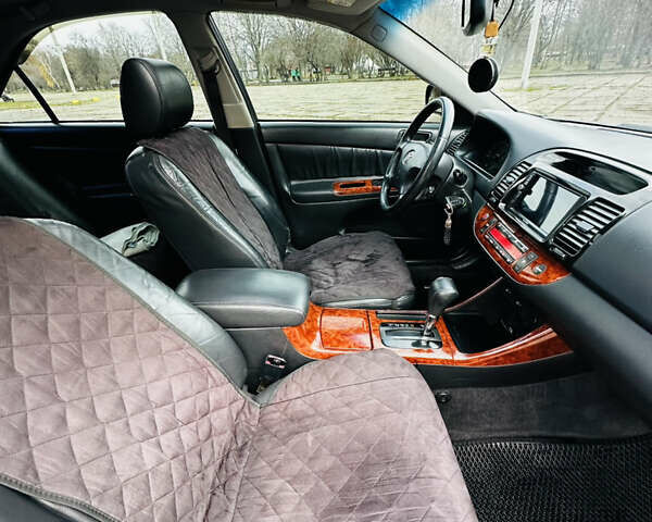 Черный Тойота Камри, объемом двигателя 3 л и пробегом 301 тыс. км за 4500 $, фото 23 на Automoto.ua