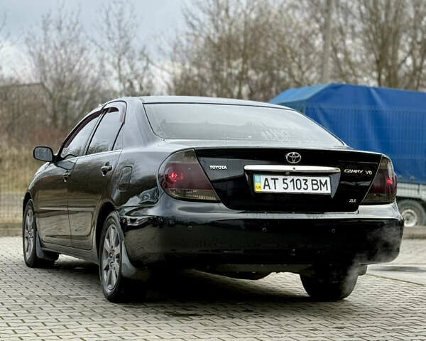Чорний Тойота Камрі, об'ємом двигуна 3 л та пробігом 203 тис. км за 3999 $, фото 8 на Automoto.ua