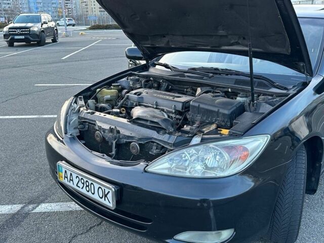 Черный Тойота Камри, объемом двигателя 2.4 л и пробегом 313 тыс. км за 5800 $, фото 19 на Automoto.ua