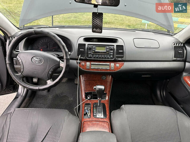 Черный Тойота Камри, объемом двигателя 2.4 л и пробегом 553 тыс. км за 5100 $, фото 11 на Automoto.ua