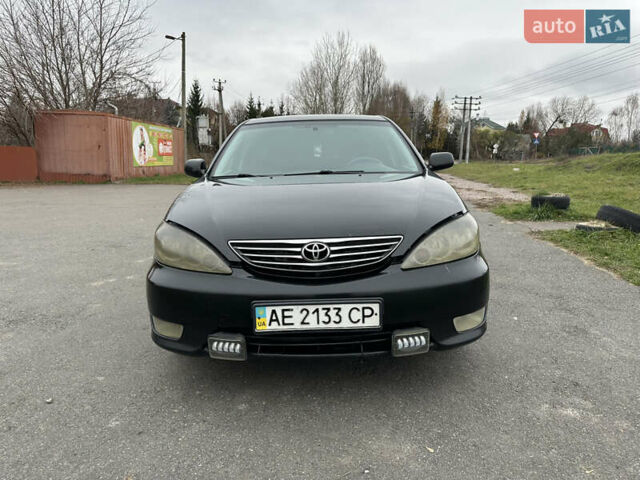 Черный Тойота Камри, объемом двигателя 2.4 л и пробегом 553 тыс. км за 5100 $, фото 1 на Automoto.ua