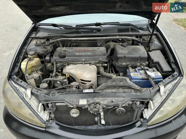 Черный Тойота Камри, объемом двигателя 2.4 л и пробегом 553 тыс. км за 5100 $, фото 12 на Automoto.ua