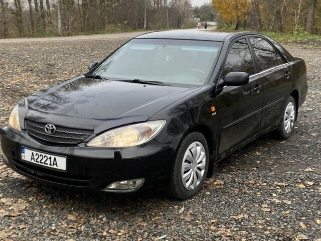 Черный Тойота Камри, объемом двигателя 2.4 л и пробегом 310 тыс. км за 5600 $, фото 2 на Automoto.ua