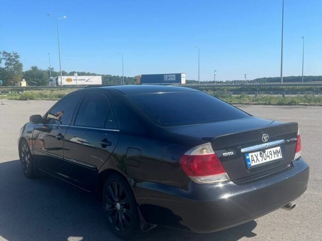 Чорний Тойота Камрі, об'ємом двигуна 2.4 л та пробігом 240 тис. км за 6200 $, фото 2 на Automoto.ua