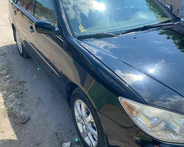 Черный Тойота Камри, объемом двигателя 2.36 л и пробегом 285 тыс. км за 6300 $, фото 9 на Automoto.ua