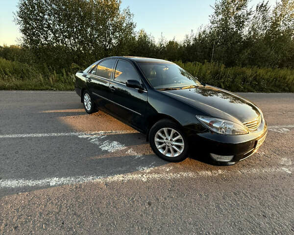 Черный Тойота Камри, объемом двигателя 3 л и пробегом 300 тыс. км за 6000 $, фото 6 на Automoto.ua