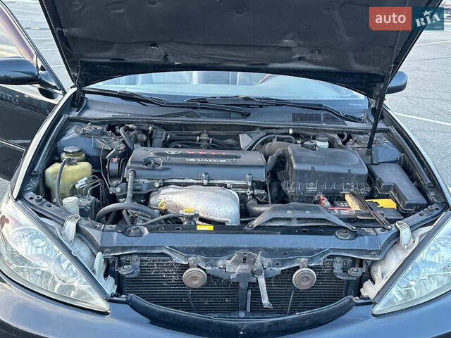 Черный Тойота Камри, объемом двигателя 2.4 л и пробегом 309 тыс. км за 6699 $, фото 16 на Automoto.ua