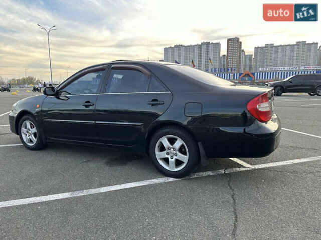 Черный Тойота Камри, объемом двигателя 2.4 л и пробегом 315 тыс. км за 5800 $, фото 11 на Automoto.ua